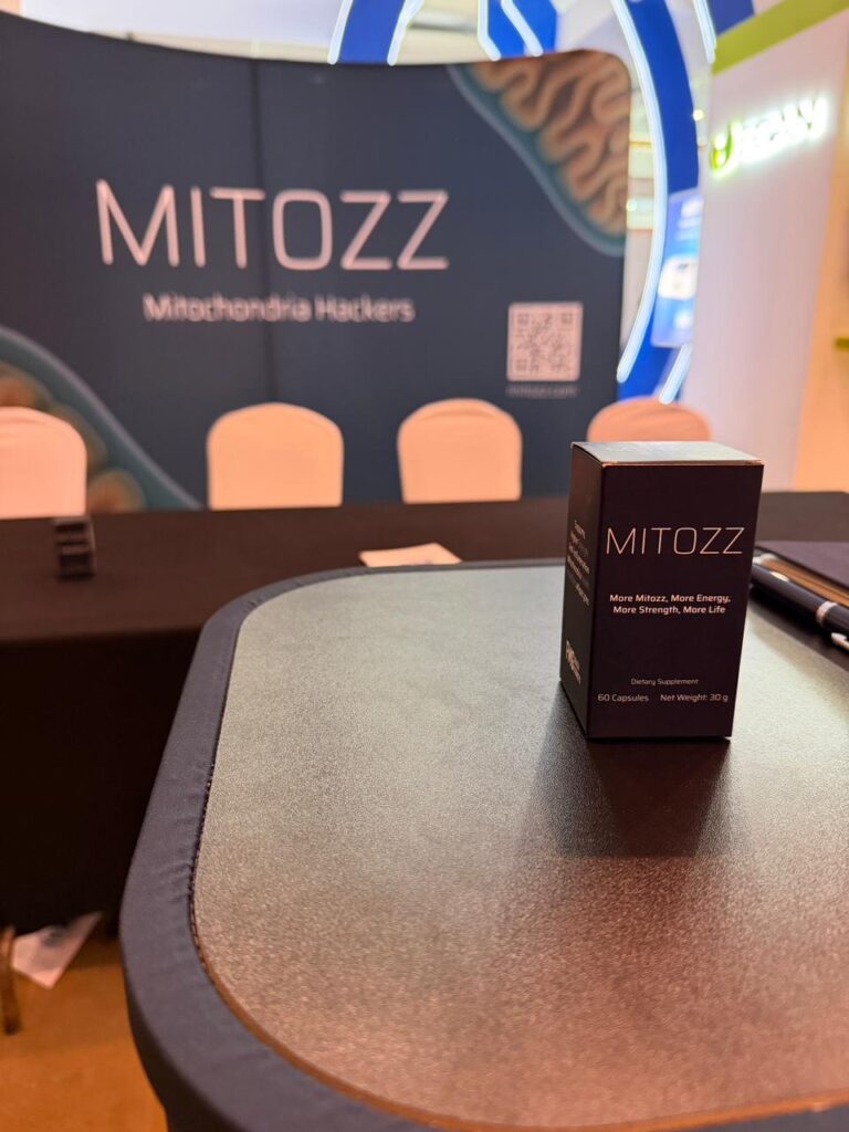 Mitozz product displayed on the official conference table during Mitozz Events, highlighting mitochondrial health innovation.
