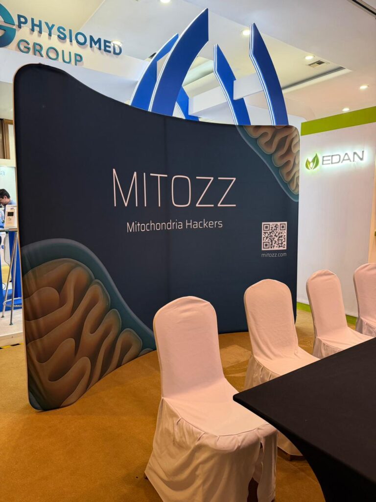Mitozz Events booth setup showcasing the brand’s mitochondrial health display at a wellness conference.