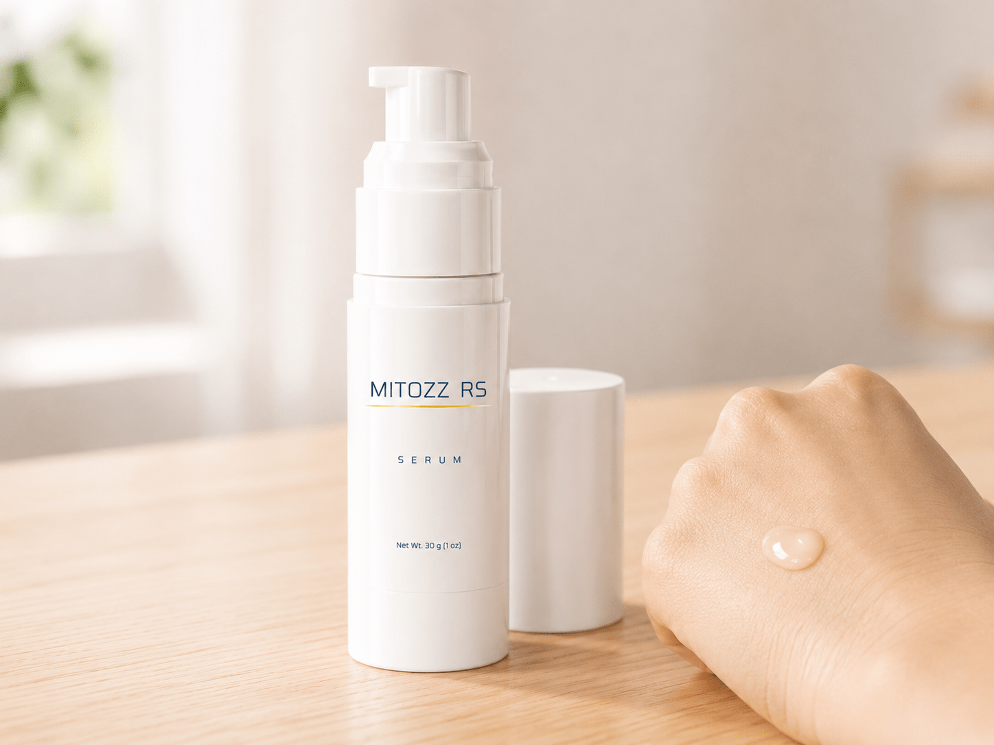 Mitozz RS topical cosmetic serum bottle with a small amount of serum on the back of a hand.