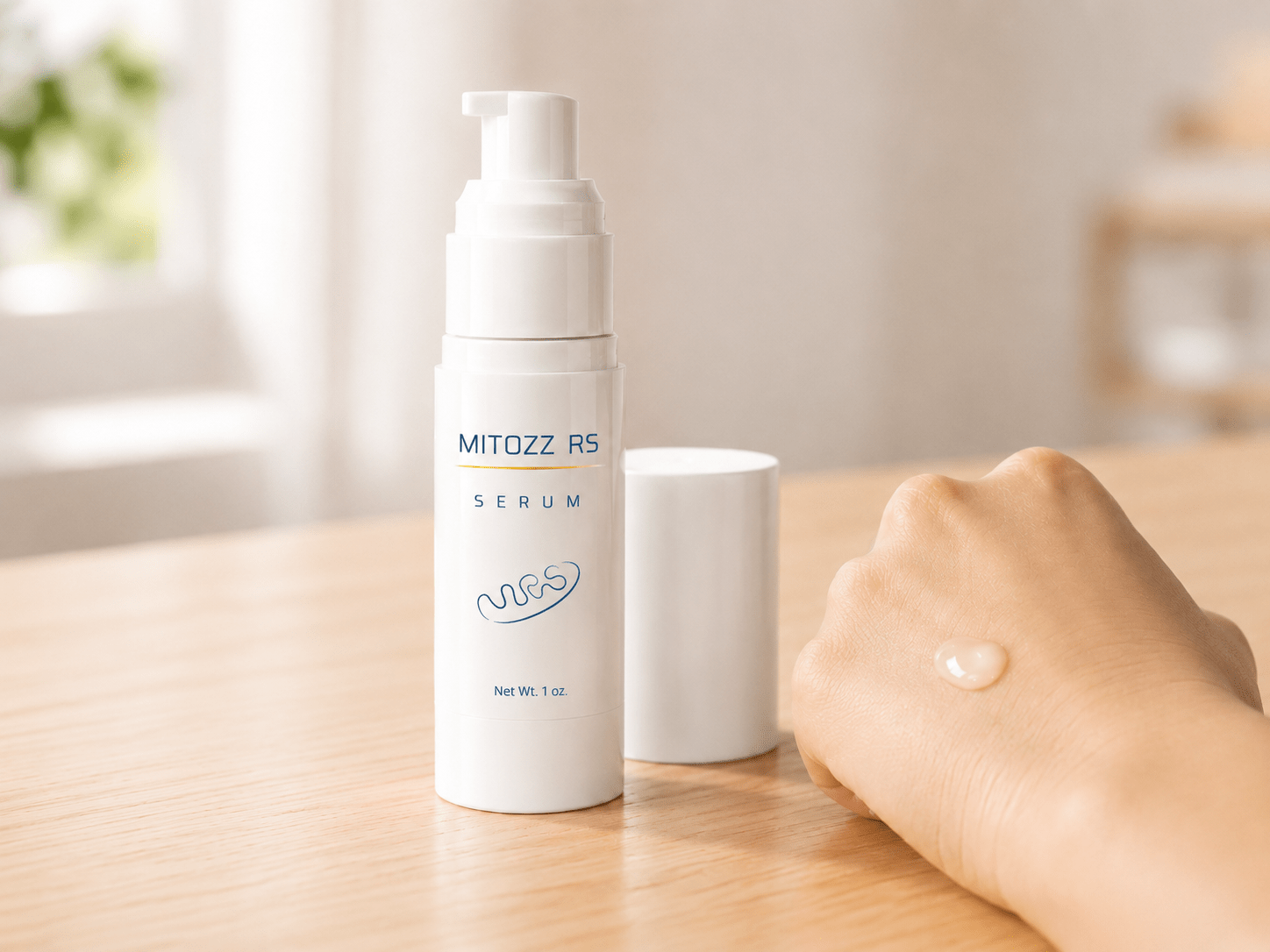 Mitozz RS serum bottle with cap beside it and a small amount of serum on the back of a hand in soft natural light.