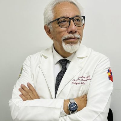 Professional portrait of CSO Doctor Guillermo Ceballos researcher and scientific officer wearing a white lab coat. About us section